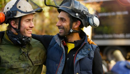 Two Tree Surgeons Laughing and Looking at Each Other